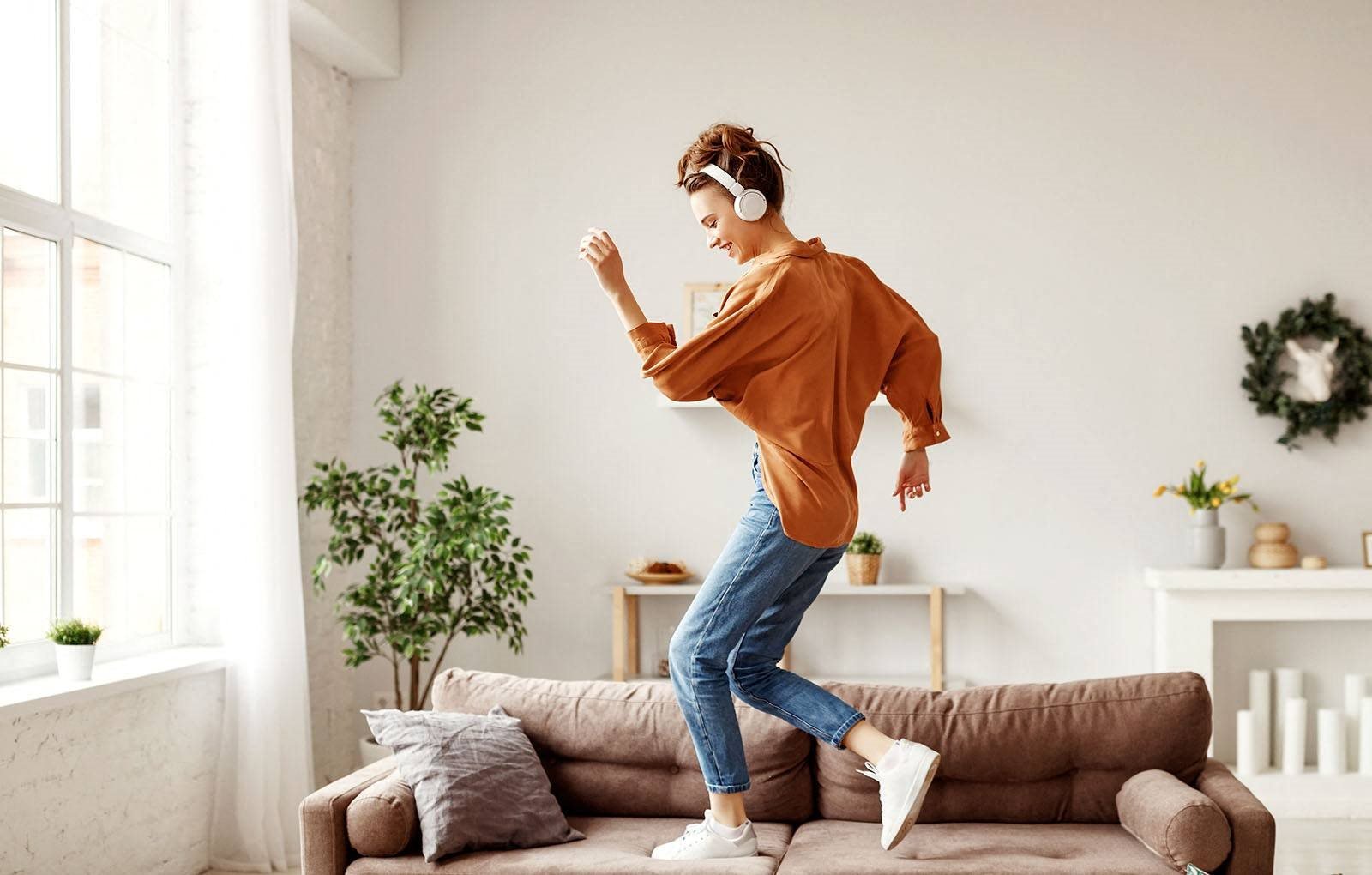 Girl dancing on couch